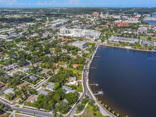 birds eye view of property with a water view