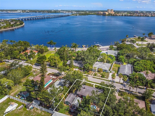 birds eye view of property with a water view