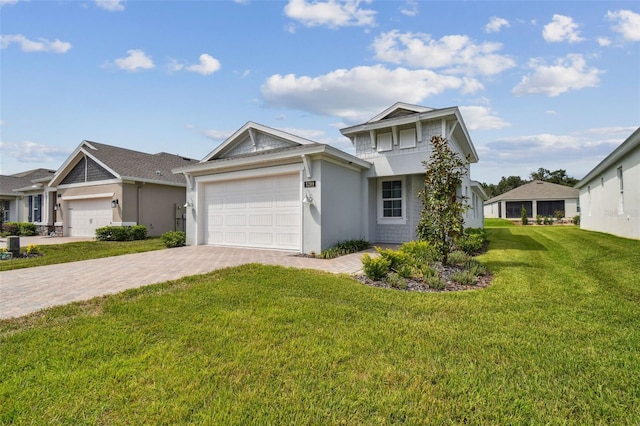 view of front of house with a garage and a front yard