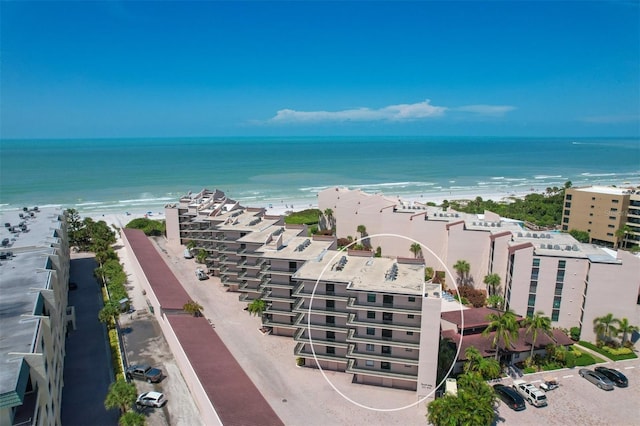 birds eye view of property featuring a view of the beach and a water view