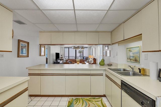 kitchen featuring kitchen peninsula, dishwasher, and cream cabinets