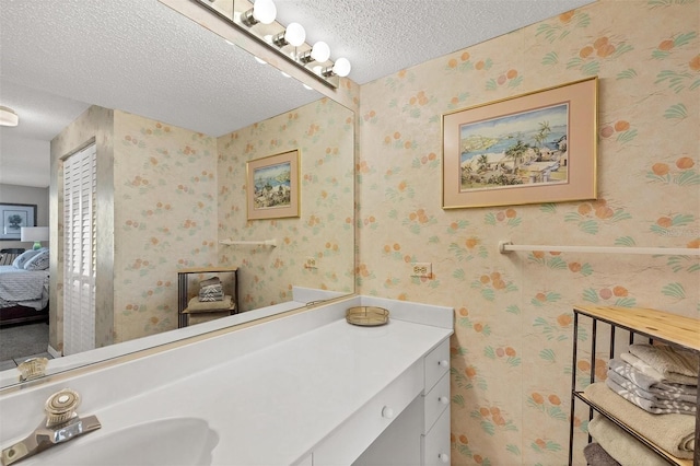 bathroom featuring vanity and a textured ceiling