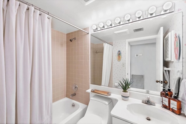 full bathroom with vanity, toilet, and shower / bath combo with shower curtain