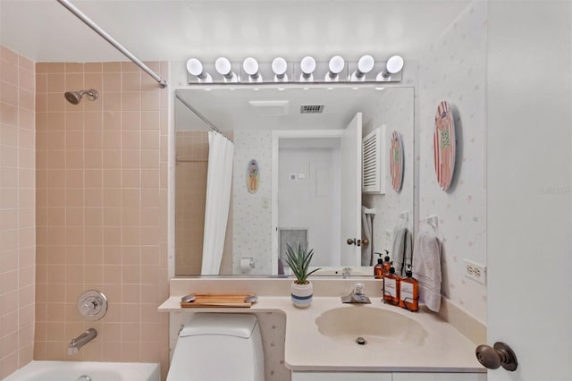 full bathroom featuring vanity, toilet, and shower / bath combo with shower curtain