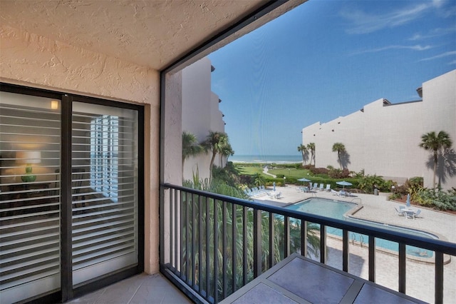 balcony featuring a water view