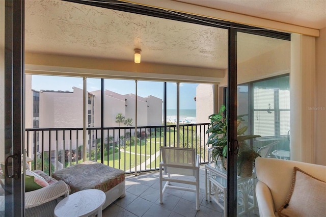 sunroom / solarium with a water view