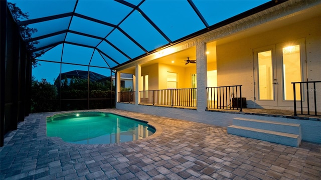 view of pool featuring a hot tub, ceiling fan, a patio area, and a lanai