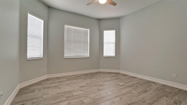 unfurnished room featuring light wood-type flooring and ceiling fan