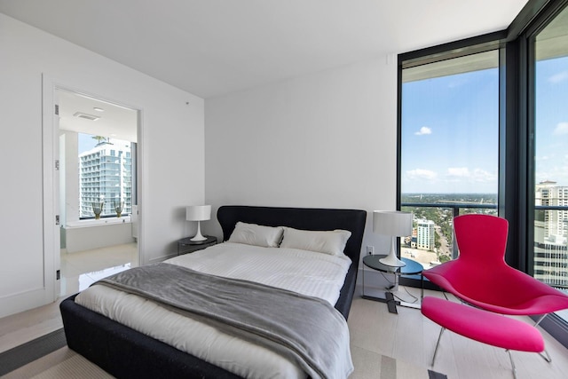 bedroom featuring expansive windows