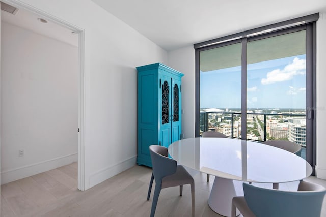 dining space featuring light hardwood / wood-style flooring