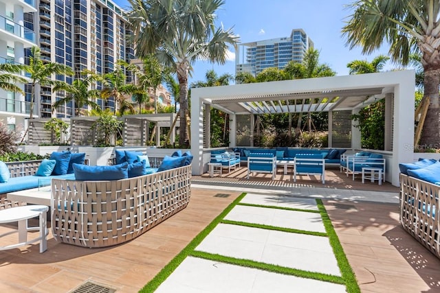 view of terrace with a balcony and an outdoor living space