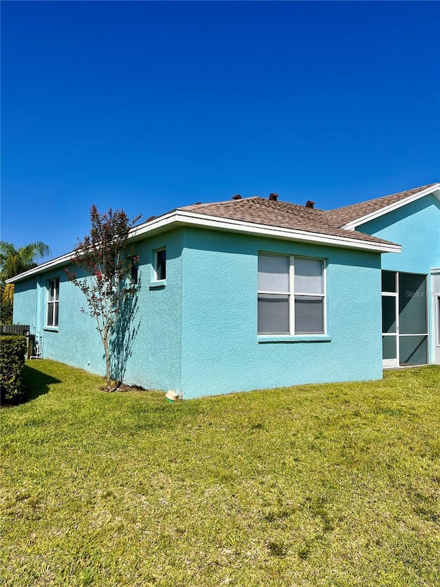 view of home's exterior with a yard