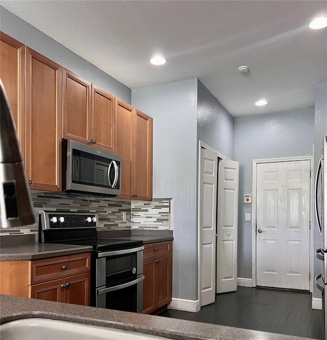 kitchen featuring backsplash and stainless steel appliances