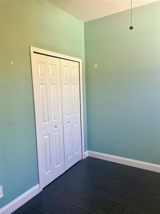 unfurnished bedroom featuring a closet