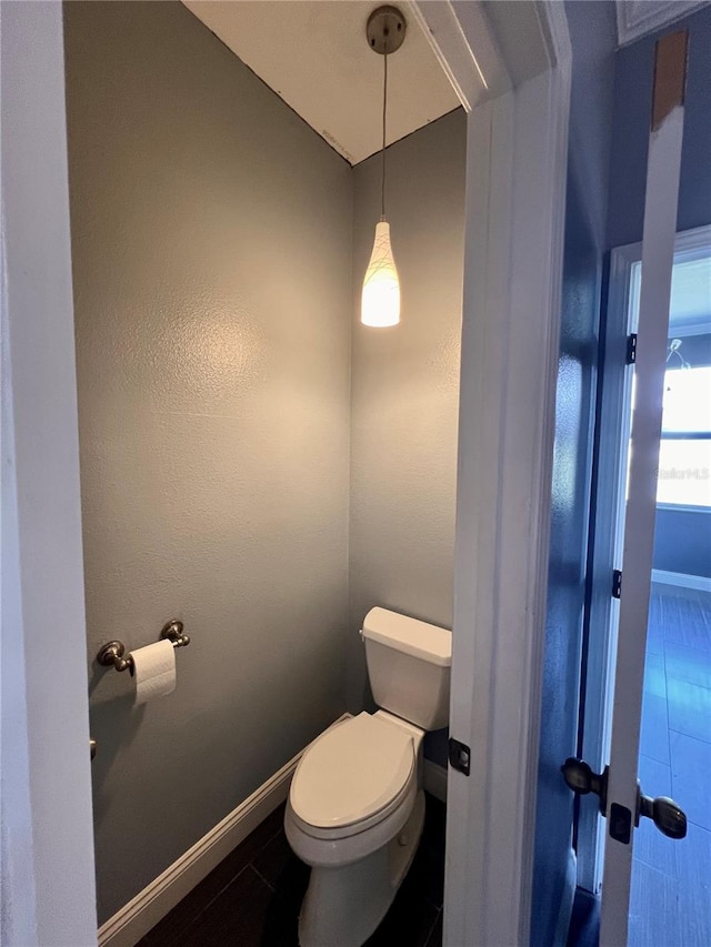 bathroom featuring tile floors and toilet