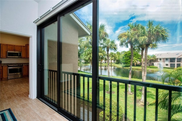 balcony featuring a water view