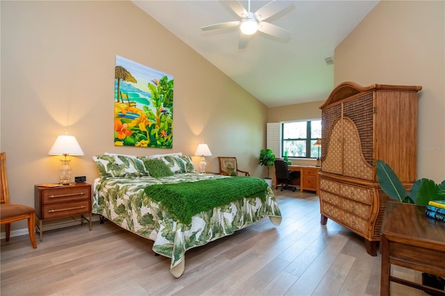 bedroom with visible vents, a ceiling fan, vaulted ceiling, and wood finished floors