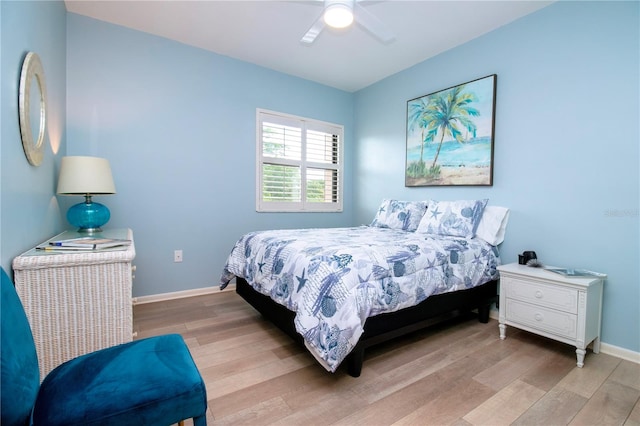 bedroom featuring light hardwood / wood-style flooring and ceiling fan