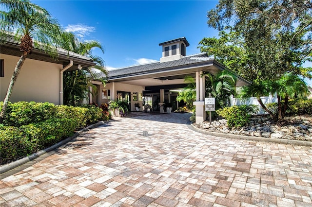 exterior space featuring decorative driveway