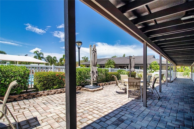 view of patio featuring a fenced backyard and outdoor dining space