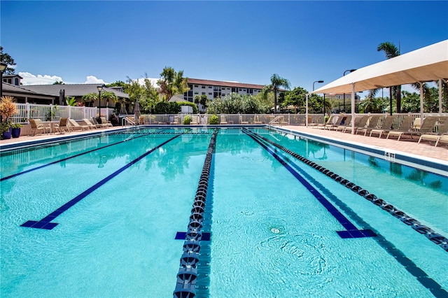 community pool featuring fence