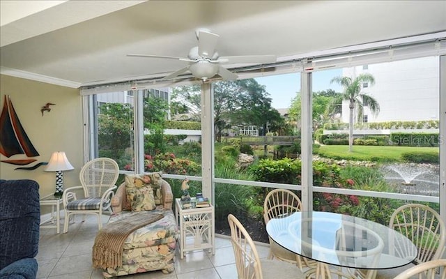 sunroom / solarium with plenty of natural light and ceiling fan