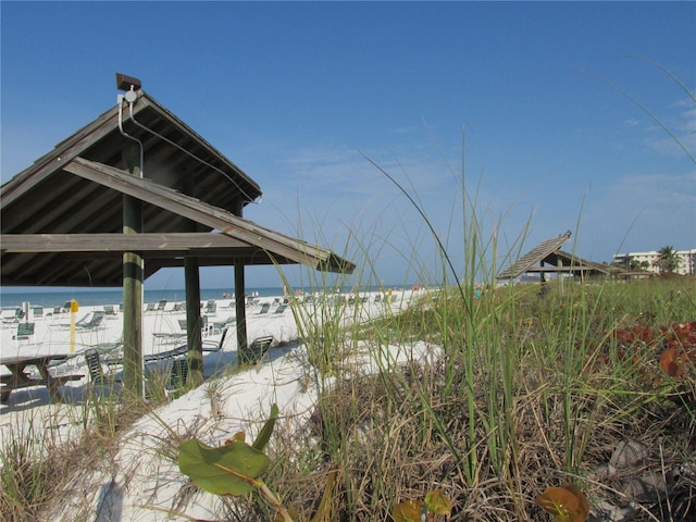 view of dock featuring a water view and a gazebo