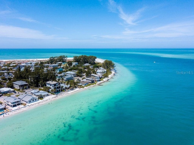 birds eye view of property with a beach view and a water view