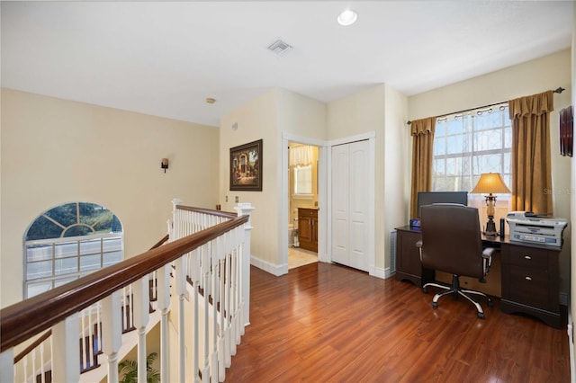 office with dark wood-type flooring