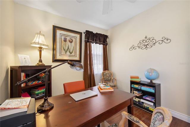 office space featuring ceiling fan and dark hardwood / wood-style flooring