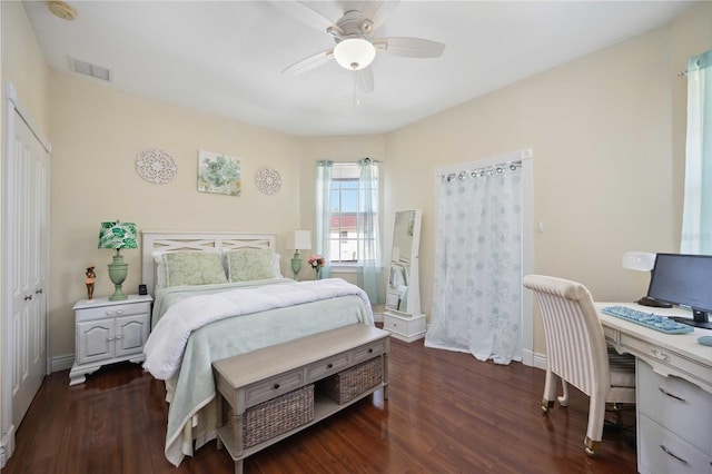 bedroom with a closet, ceiling fan, and dark hardwood / wood-style flooring