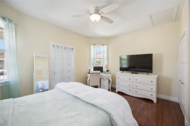 bedroom with ceiling fan and dark wood-type flooring