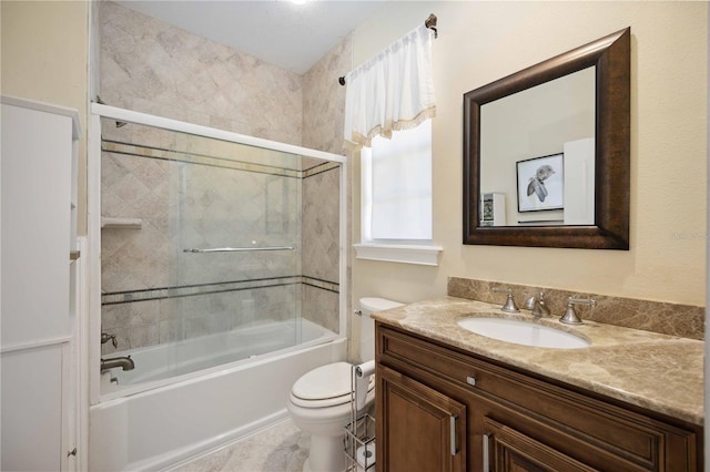 full bathroom featuring tile floors, toilet, vanity, and tiled shower / bath