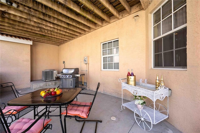 view of patio with grilling area and central air condition unit