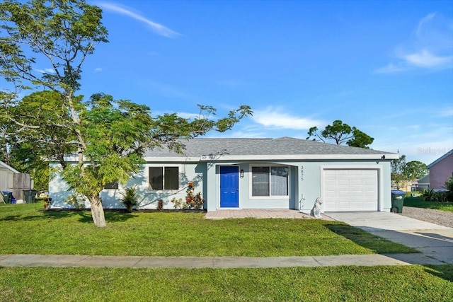 single story home with a front lawn and a garage