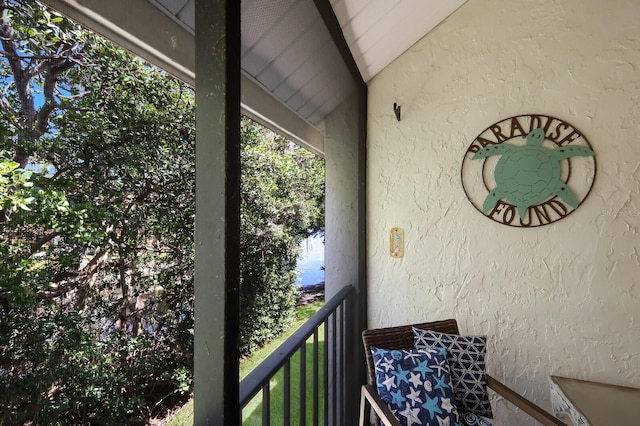 balcony featuring a water view