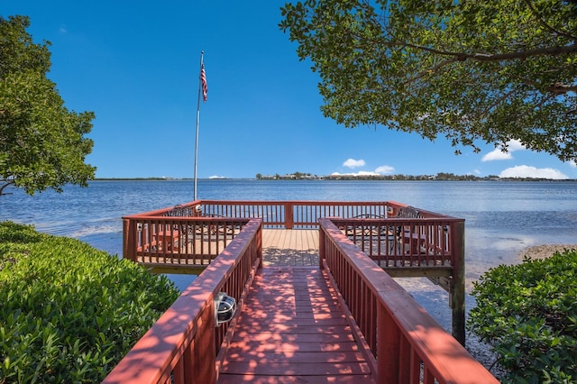 dock area featuring a water view and central AC unit