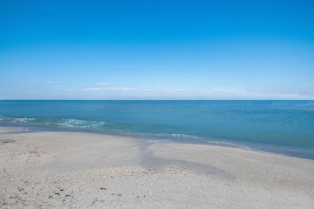 view of water feature with a beach view