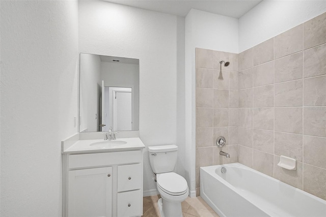 full bathroom with toilet, vanity, tiled shower / bath combo, and tile patterned flooring