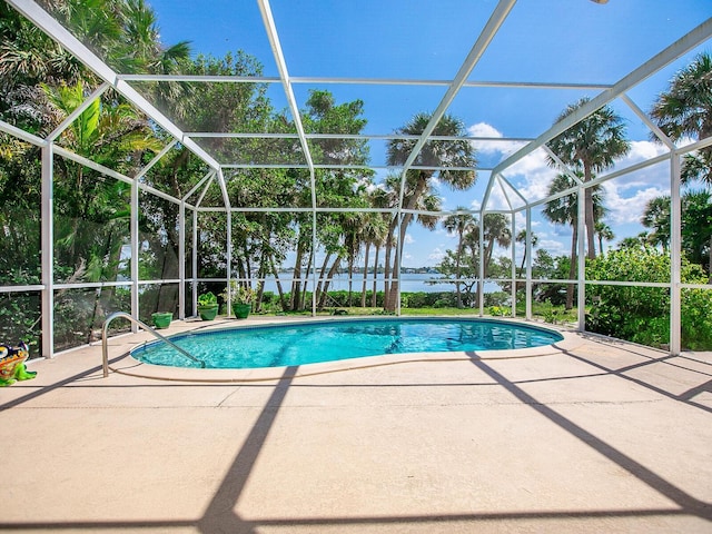 view of pool featuring a lanai and a patio