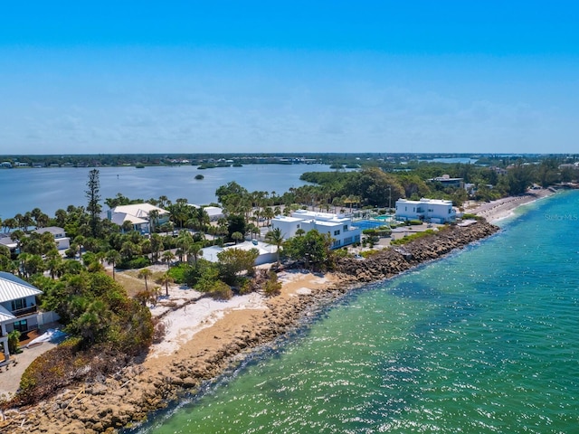 birds eye view of property featuring a view of the beach and a water view