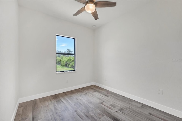 spare room featuring ceiling fan and light wood-type flooring