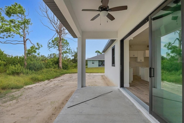 view of patio / terrace featuring ceiling fan