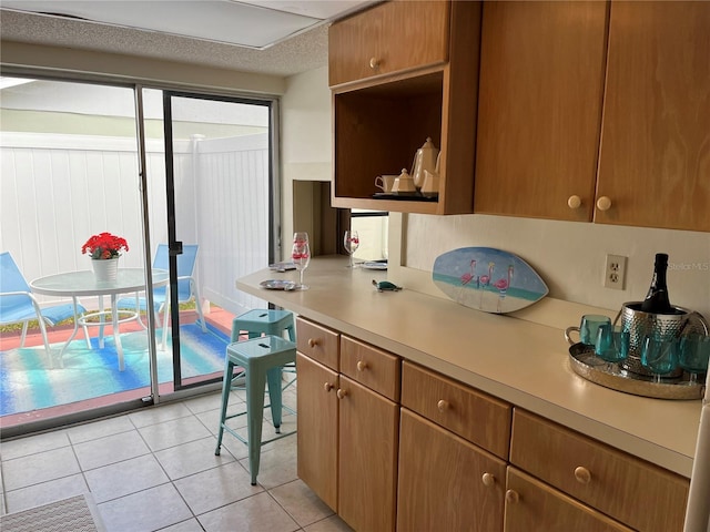 kitchen featuring light tile floors