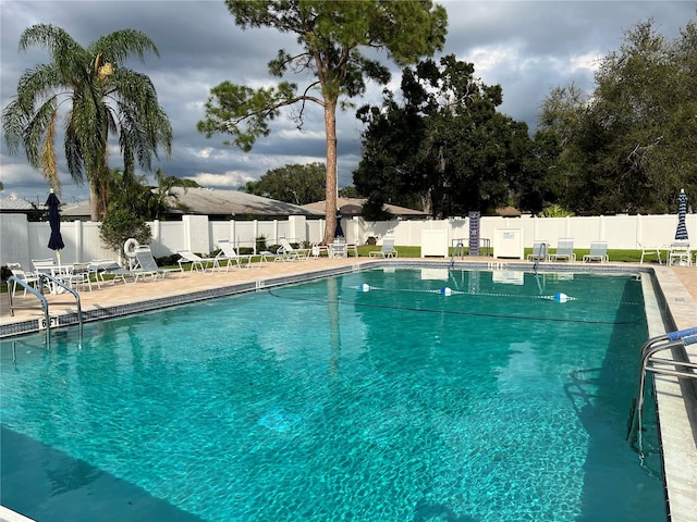 view of swimming pool featuring a patio