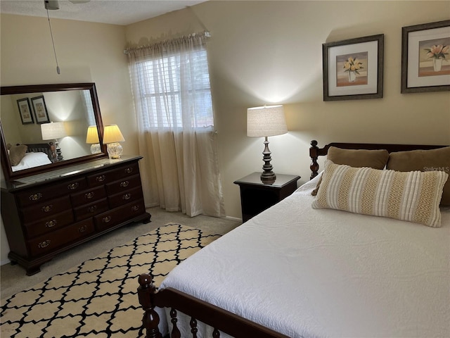 bedroom featuring light colored carpet