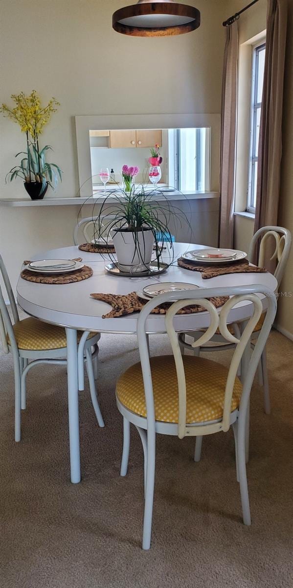 view of carpeted dining space