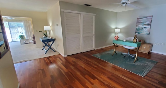 office with ceiling fan and dark hardwood / wood-style flooring