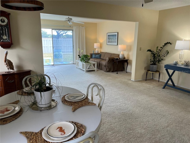 interior space featuring ceiling fan and carpet floors