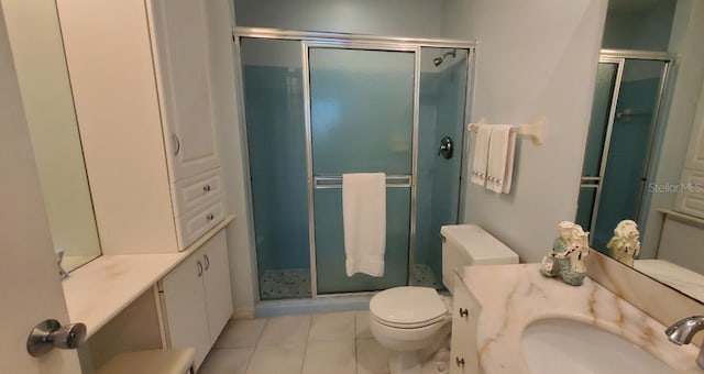 bathroom featuring an enclosed shower, toilet, tile flooring, and vanity